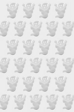 White ghosts on a white background; Halloween ghost pattern