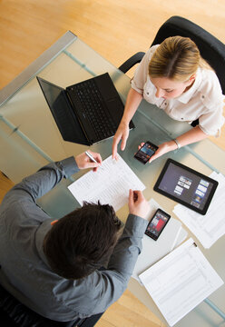 Business Man And Woman Using Mobile Devices