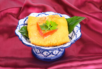 Kanom Buang or Thai dessert  Pancakes by egg ,powder white coconut slice ,pork. on thai plate .thai  cuisine.