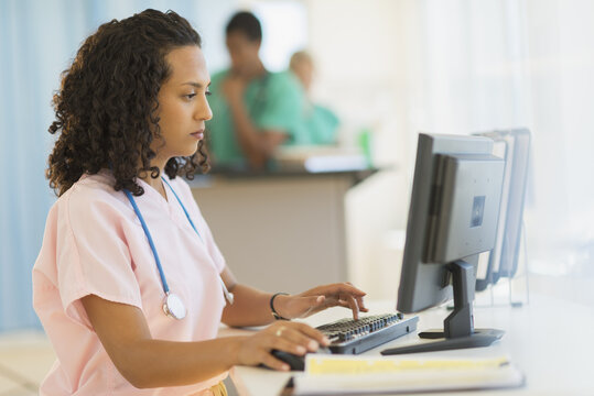 Doctor working at desks in hospital