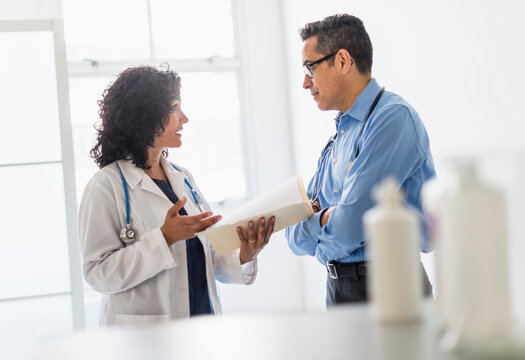 Female And Male Doctors Working Together