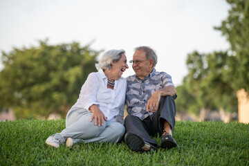 Naklejka na ściany i meble Senior couple looking at each other outdoors