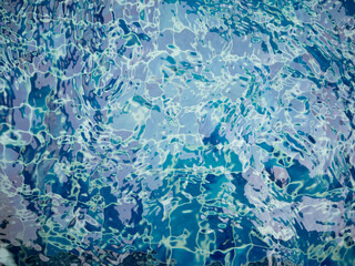 blue water surface texture in swimming pool use for background