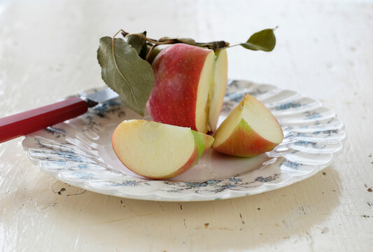 Studio shot of sliced apple on plate - Powered by Adobe