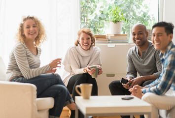 Group of friends hanging out in living room