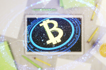 Double exposure of creative Bitcoin symbol and digital tablet on background, top view. Cryptocurrency concept