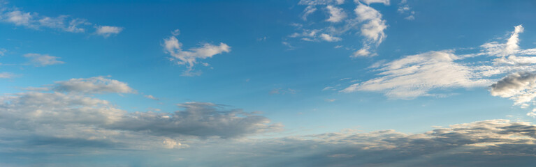 Fantastic clouds against blue sky, panorama