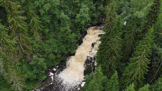 bungee under big waterfall cascade fall Jukankoski Russian Karelia. aerial view