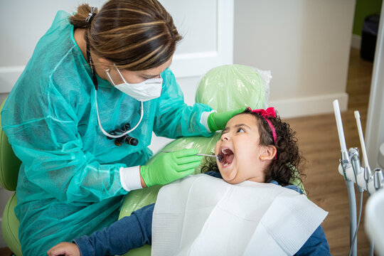 dentist examining a young patient