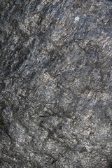 Granite, basalt stone wall texture.