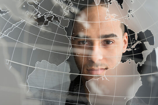 Digital portrait of young man on world map