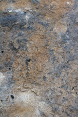 Granite stone wall texture. Background rock backdrop with rough abstract grunge textured surface of stony material nature detail of rocks.