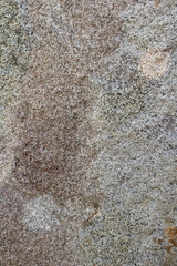 Granite stone wall texture. Background rock backdrop with rough abstract grunge textured surface of stony material nature detail of rocks.