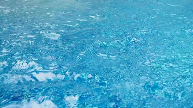 Flowing Water In Swimming Pool With Underwater Jet System Making Bubble To Body Massage For Reduce Pain And Relaxation. Summer Activity For Happiness Concept
