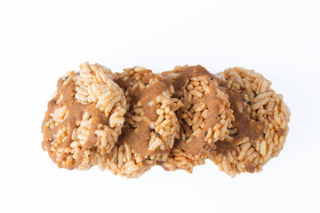 Thai Sweet Crispy Rice Cakes with Cane Sugar Drizzle. on white background 