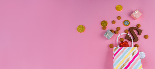 Dutch holiday Sinterklaas Greeting Card. St. Nicholas Day background with traditional food - pepernoten, chocolate letter, gift, carrots for horse. Concept for party in Saint Nicolas day five december