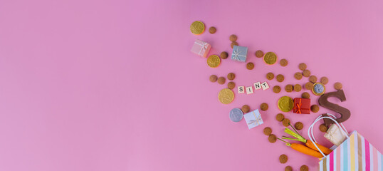 Dutch holiday Sinterklaas Greeting Card. St. Nicholas Day background with traditional food - pepernoten, chocolate letter, gift, carrots for horse. Concept for party in Saint Nicolas day five december
