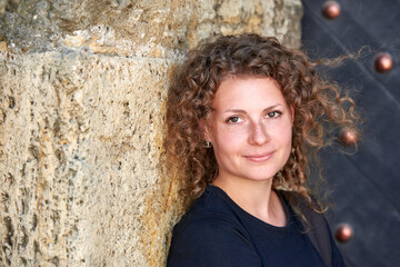 Portrait of a pretty woman with curly hair.