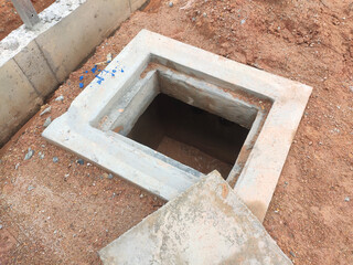 SEREMBAN, MALAYSIA -AUGUST 6, 2020: Utility services manhole and underground pipes under construction at the construction site. In-situ construction by workers based on infrastructure engineer design.