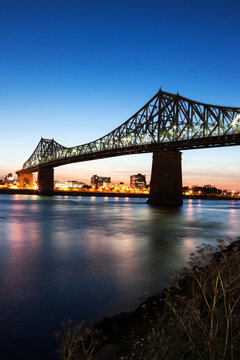 Illuminated Jacques Cartier Bridge against sky