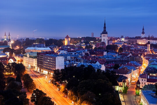 Elevated view of illuminated city at dusk