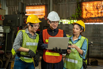 Industrial workers use laptop working on projects in industrial.