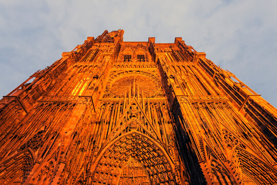Illuminated facade of Strasbourg Minster against sky