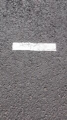 arrow sign on asphalt