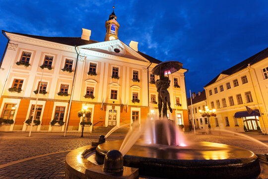 Kissing Students Fountain against illuminated building