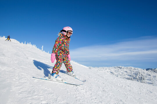 Girl (8-9) skiing in mountains