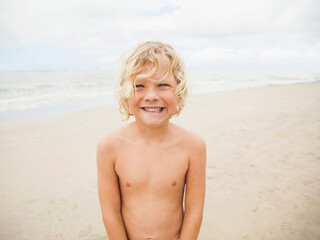 Portrait of boy (6-7) on beach