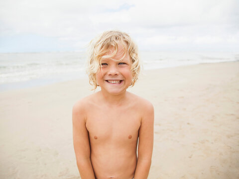 Portrait of boy (6-7) on beach