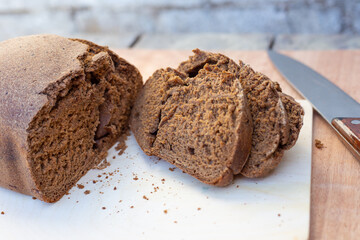 fresh loaf of black bread, cut into pieces, baked in an electric bread maker. Homemade baking