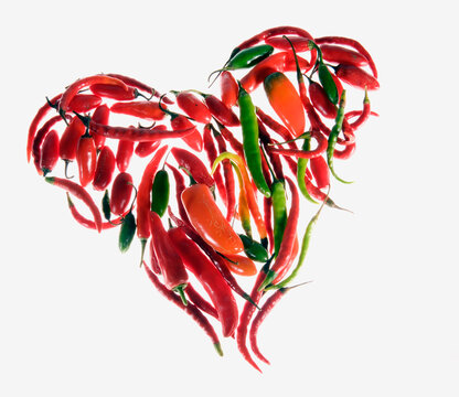 Different Kind of peppers arranged in shape of heart