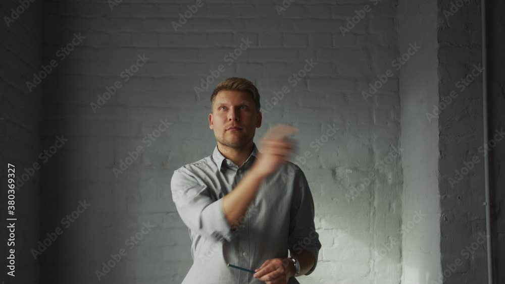 Poster Young businessman at work in the office