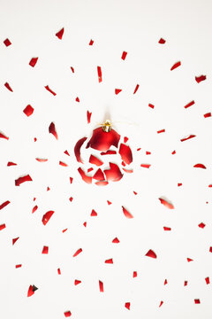 Red Christmas Ornament Exploded on White Background.
