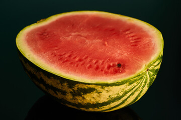 slice of watermelon on black background