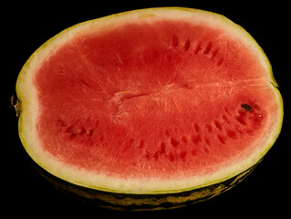slice of watermelon on black background