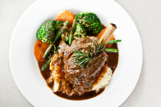 lamb shank on white plate