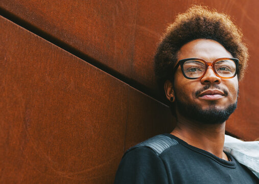 Portrait of attractive young man in outdoors.
