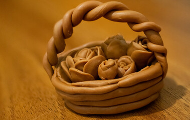 clay roses in a clay basket