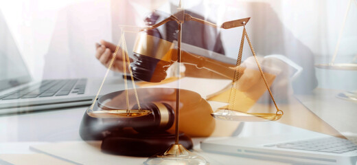 justice and law concept.Male judge in a courtroom on wooden table and Counselor or Male lawyer working in office. Legal law, advice and justice concept.