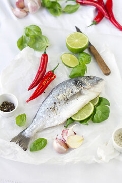 Gilthead seabream with lime, garlic, basil and chili