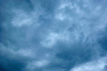 Dark blue gloomy, formidable sky in the clouds.