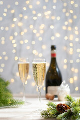 Glasses with champagne at new year christmas celebration table