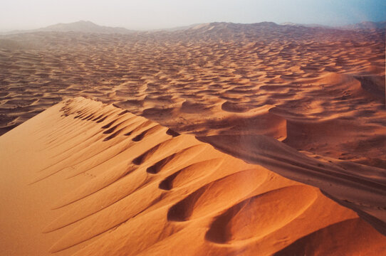Morocco, Merzouga, footprints on the dunes of the Sahara desert