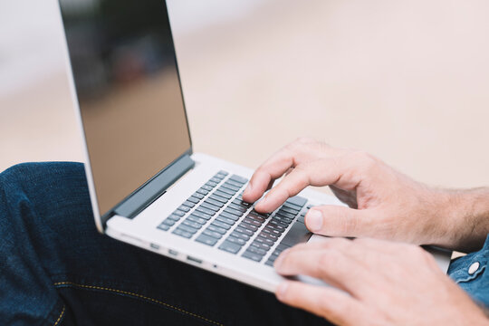 man with laptop outside