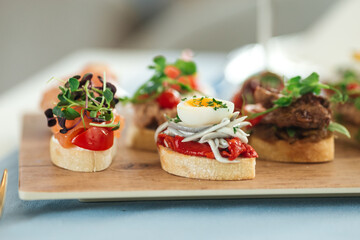 Closeup on assorted tapas with different toppings