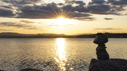 Sunset over the lake with reflections on the surface