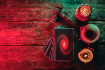 Tarot cards deck on the old table background.